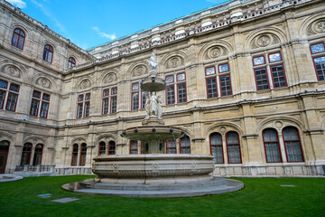 Fototapeta premium Fountain park on the side of Vienna Opera House