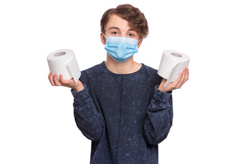 Concept of coronavirus quarantine. COVID-19 - home isolation. Teen boy wearing medical protective face mask to health protection from influenza virus, isolated on white. Child holds toilet paper.