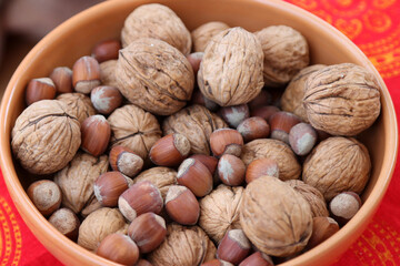 A cup with walnuts and hazelnuts