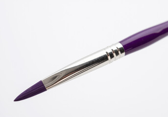 Naklejka premium A purple-handled paintbrush