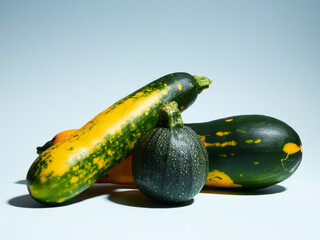 Organic zucchini over blue background