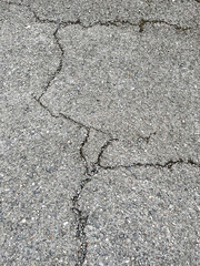 asphalt cracks, pavement destruction, patched asphalt texture of white paint for road marking on asphalt, texture of painted asphalt cracked texture white background, white background on gray wall