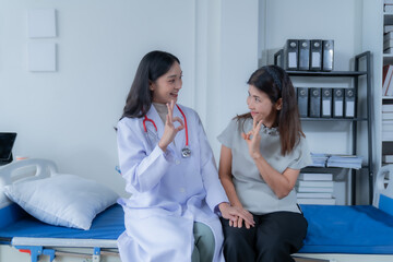 Fototapeta premium consulting female patient about pills and discussing health treatment sitting in the office at the desk. Medicine and health care concept. Doctor prescribing medicine to patient in the office.
