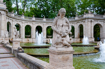 Scene at the historic fairytale fountain with figures from the Grimm Brothers' stories in...