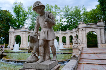 Scene at the historic fairytale fountain with figures from the Grimm Brothers' stories in...