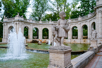 Scene at the historic fairytale fountain with figures from the Grimm Brothers' stories in...