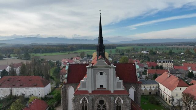 Aerial drone shot of the church of the Parish of the Assumption of the Blessed Virgin Mary and St. James the Elder in Kamieniec Zabkowicki. Roman Catholic parish church in Kamieniec Zabkowicki.