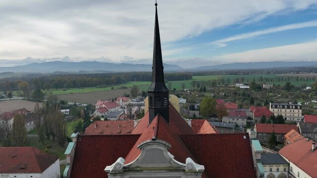 Aerial drone shot of the church of the Parish of the Assumption of the Blessed Virgin Mary and St. James the Elder in Kamieniec Zabkowicki. Roman Catholic parish church in Kamieniec Zabkowicki.