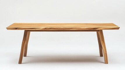 A Scandinavian style wooden dining table with sleek legs on a white background