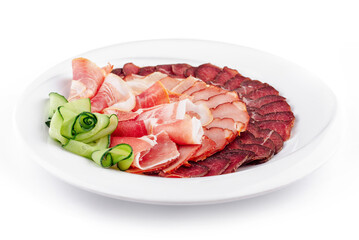 Plate presenting delicious cured meat slices with cucumber decoration