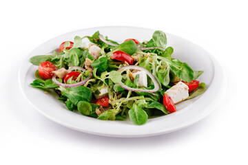 Fresh tuna salad with lettuce, tomatoes and feta cheese on white plate
