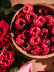 Fresh Raspberries: Juicy, Ripe Berries for a Healthy Summer Snack on a Wooden Background