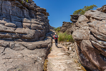 Hiker passes the Street of Silence on the hike to Pinnacle Lookout in the Grampians National Park,...