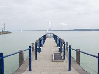 A jetty on the lake Balaton with blue water.