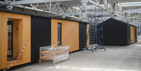 A new wooden modular prefabricated house inside in manufacturing facility