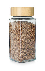 Coriander in glass jar isolated on white