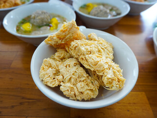 Dried crispy tofu skin for snacks or side dishes at meatball noodle stall