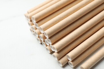 Many bamboo drinking straws on white background, closeup