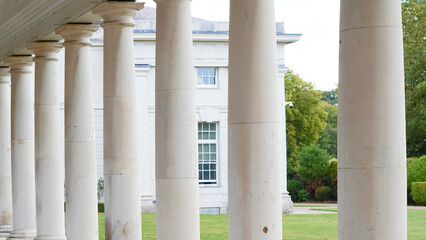Vintage white columns from old English buildings, showcasing classic design.