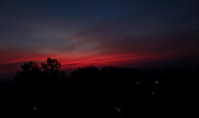 Sunset scenery view, silhouette of trees and buildings, night sky background, nature photography 