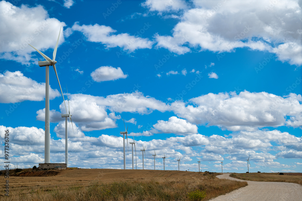 Wall mural wind farm, wind turbines, alternative energy plant in a field