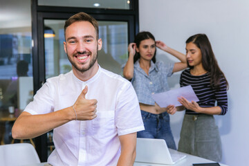 Obraz premium Businessmans crew working with new startup project in modern Office. Group of diverse businesspeople working together around a meeting table in an office