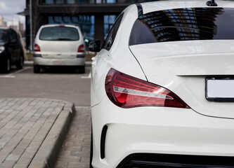 rear lights of a white premium car