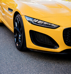 Fototapeta premium headlight of luxury yellow sportscar.