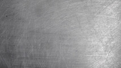 The steel plate surface has scratches from use.