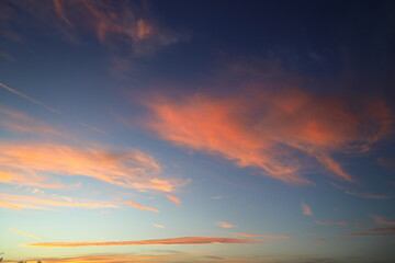 Blurry background of red sunset sky. Dramatic sky with colorful cloud background. Red burning sunset sky. Copy space.