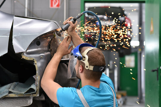 repair car body by a mechanics in the workshop