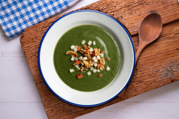 Spinach cream made with pear, vegetables and walnuts. Top view table with  decorations.