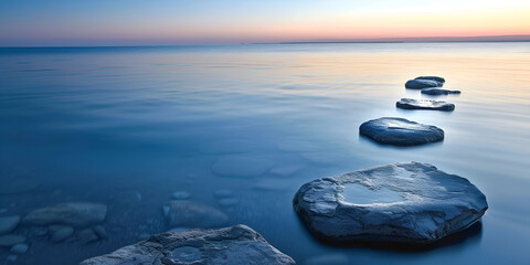 Peaceful Sunset over Calm Water with Stones Path
