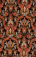 A textile with an elegant pattern of stylized red, gold and teal floral motifs on a black background.