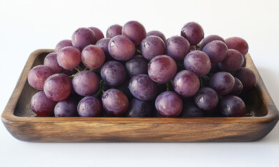 Obraz premium Fresh Red Grapes in Wooden Bowl on White Background