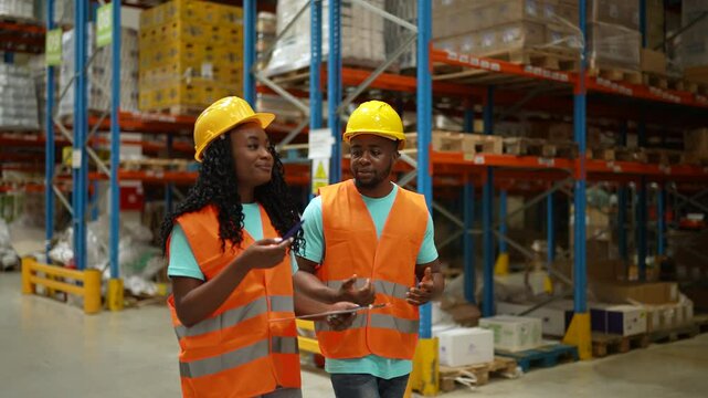 Diverse team collaborating in a busy distribution warehouse