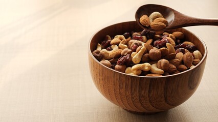 Woman picks nuts from cup, enjoying healthy snack. Close-up of hand selecting nuts, highlighting texture and variety. Ideal for projects featuring nuts, healthy eating, and nutritious snacks.