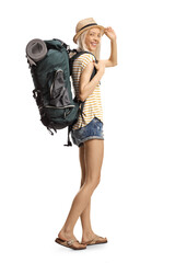 Female tourist carrying a backpack and greeting with hat