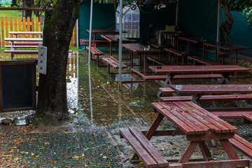 The garden of the restaurant flooded with water after the rain.