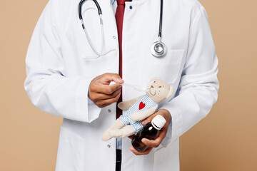 Close up young Indian doctor man wear white medical gown suit work in hospital clinic office hold...