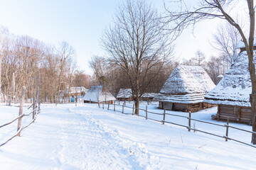 idyllic winter Ukrainian village country side traditional landscape landmark picturesque snow hills view December bright day environment space