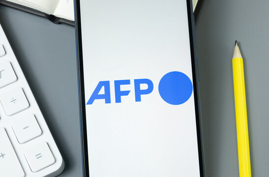 New York, USA - 30 August 2024: AFP Communications Logo on Phone Screen, Company Icon on Display