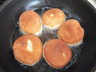 Traditional German or Austrian fried donuts with no hole, so called Krapfen, Berliner or Pfannkuchen