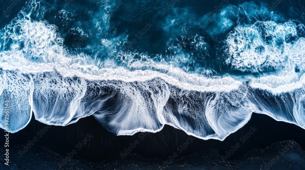 Aufkleber drone aerial perspective photo of ocean waves and foam splashing on dark navy blue or gray sand beac