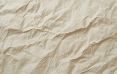 Close-up of wrinkled, beige paper. Soft, textured background.
