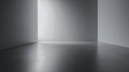 Soft gray empty room with a subtle gradient floor and a spotlight effect designed for showcasing products or presentations