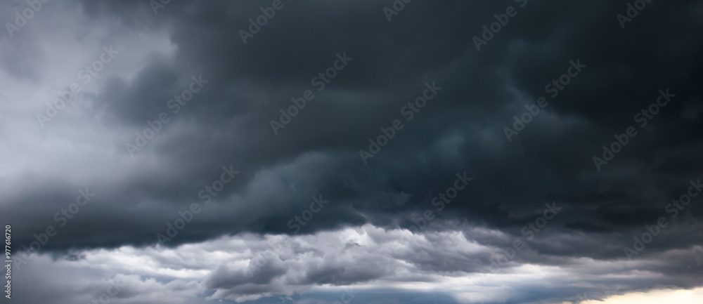 Aufkleber the dark sky with heavy clouds converging and a violent storm before the rain.bad or moody weather s