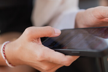 Close-up of Hand Holding Smart phone Outdoors