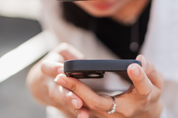 Close-up of Hand Holding Smart phone Outdoors