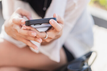 Close-up of Hand Holding Smart phone Outdoors